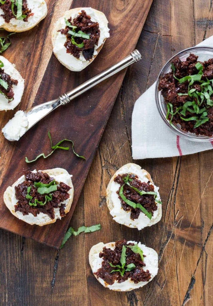 STYLECASTER | 25 Festive Recipes That Will Impress Your Friends on New Year’s Eve | Sun-dried Tomato and Kalamata Olive Bruschetta