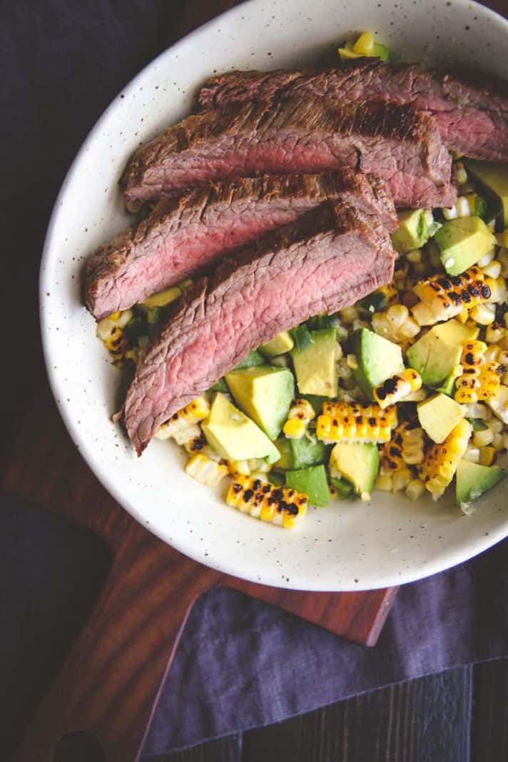 STYLECASTER | 17 High-Protein Summer Dinners With 5 Ingredients or Less | Flank Steak and Charred Corn Salad