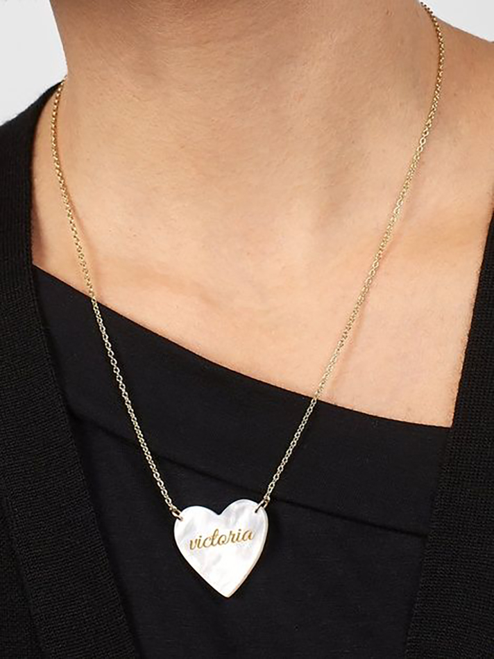 STYLECASTER | Word and Name Jewelry Is Having a Moment, Because Carrie Bradshaw Is a Forever Fashion Icon