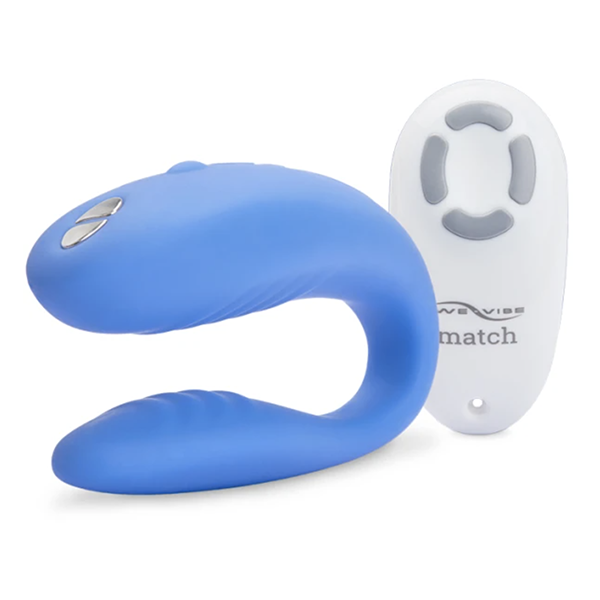 A blue vibrator in front of a remote control