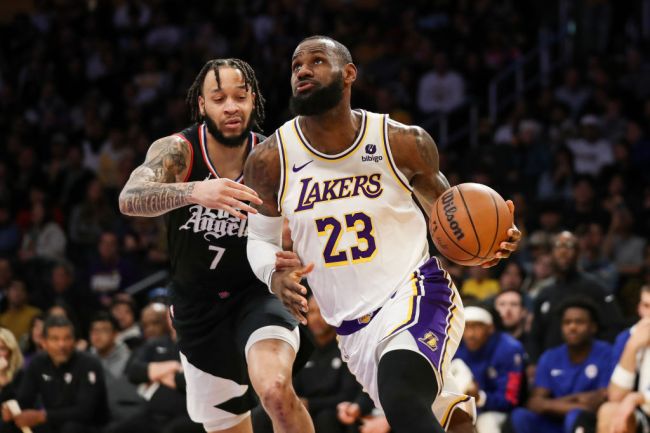 LOS ANGELES, CALIFORNIA - JANUARY 07: LeBron James #23 of the Los Angeles Lakers drives to the basket against Amir Coffey #7 of the LA Clippers in the second quarter at Crypto.com Arena on January 07, 2024 in Los Angeles, California. NOTE TO USER: User expressly acknowledges and agrees that, by downloading and or using this photograph, User is consenting to the terms and conditions of the Getty Images License Agreement.