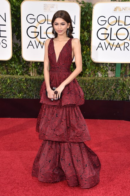 Zendaya in a burgundy lace tiered dress on the 2016 Golden Globes red carpet