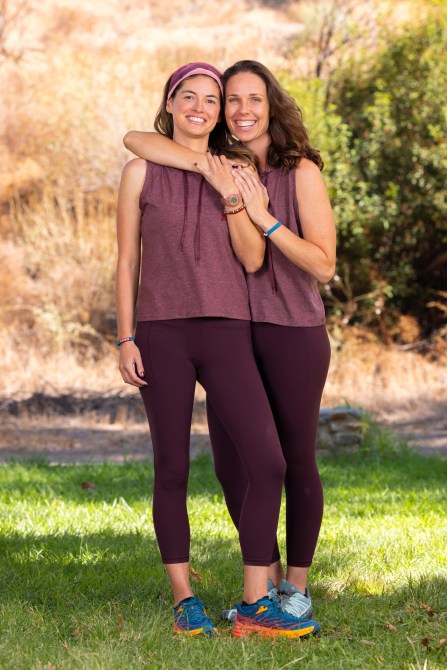 Yvonne Chavez & Melissa Main, two white women wearing matching mauve athletic wear.
