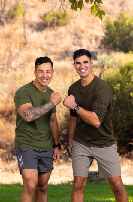 Juan Villa, a hispanic man with black hair and tattoos with Shane Bilek, a white man with black hair wearing matching green athletic wear.