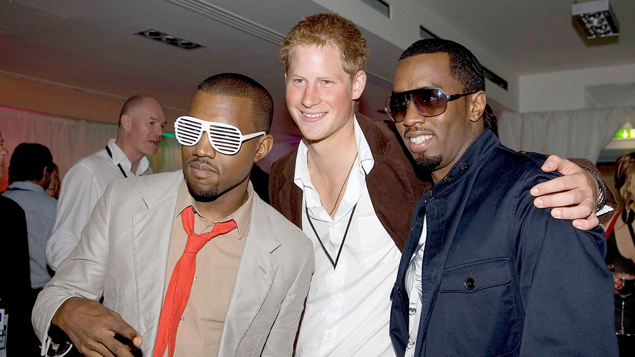 Prince Harry, a white man with red hair, posing with Kanye West, a Black man with sunglasses on, and Sean 'Diddy' Combs a Black man with Sunglasses on