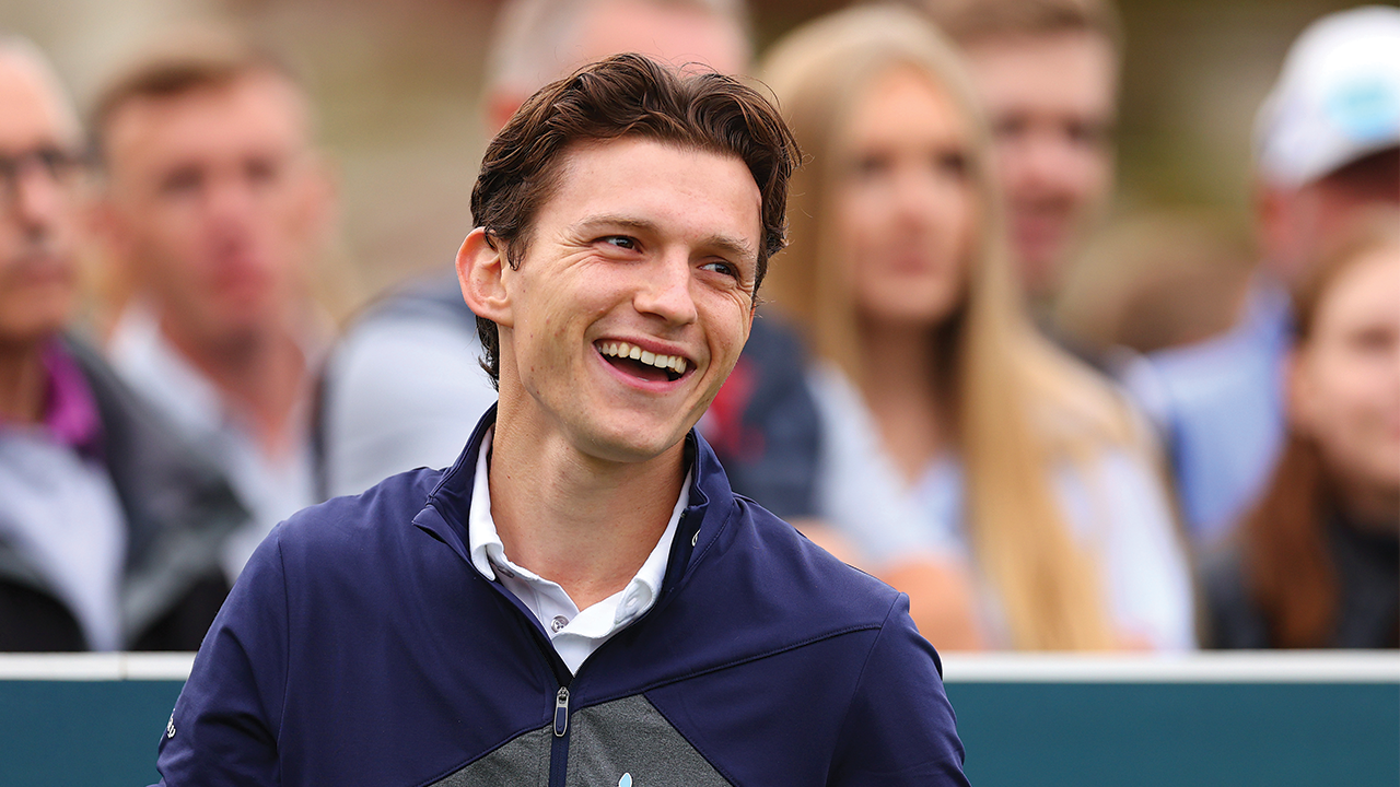 Tom Holland with long hair.