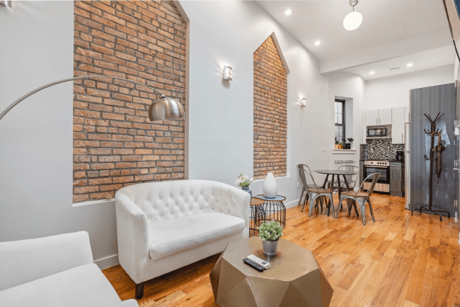 1 Bedroom Apartment in Brooklyn, New York (Williamsburg). Airbnb in NYC shows the living room and kitchen.