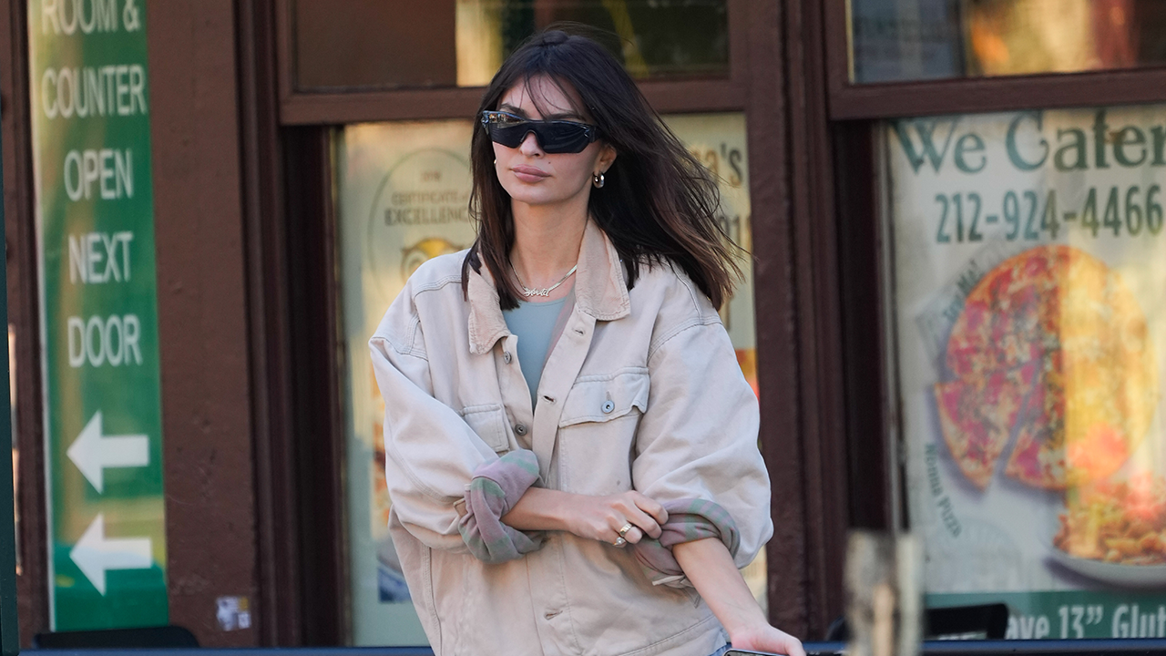 EmRata with mid-length hair and sunglasses.