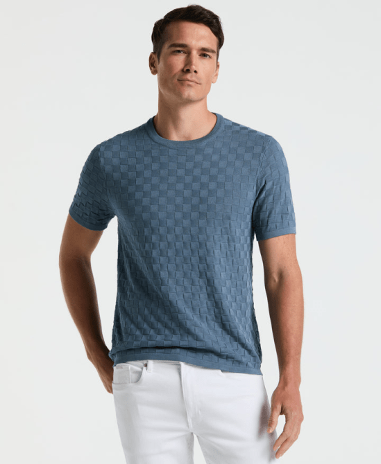 A model wearing the Perry Ellis Square Pattern Crew Neck Sweater Tee in blue