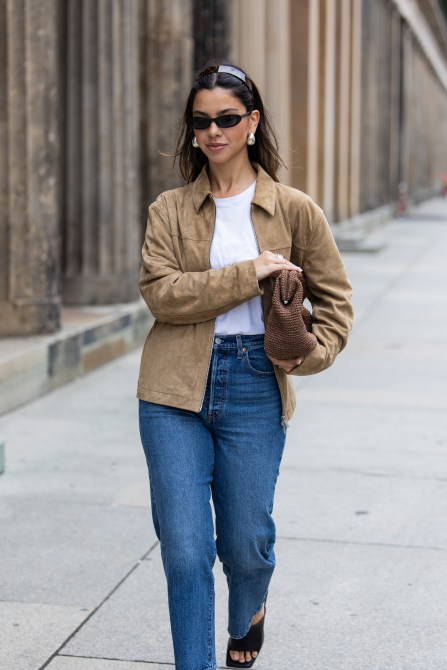 STYLECASTER | Suede jacket, jeans, clutch, and headband outfit.