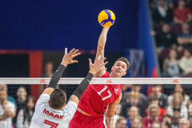 Thomas Jaeschke #17 of the United States hits the ball over the block Stephen Maar #7 of Canada during a FIVB Volleyball Nations League pool 2 match at The Arena at TD Place on June 8, 2022 in Ottawa, Canada.