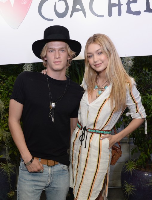 Singer Cody Simpson (L) and model Gigi Hadid attend the Official H&M Loves Coachella Party at the Parker Palm Springs on April 10, 2015 in Palm Springs, California.