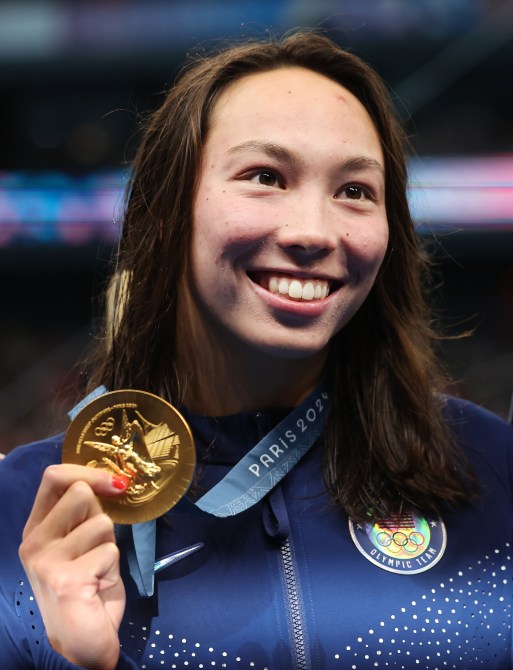 NANTERRE, FRANCE - JULY 28: Torri Huske of Team United States poses with her Gold medal from the Women's 100m Butterfly final on day two of the Olympic Games Paris 2024 at Paris La Defense Arena on July 28, 2024 in Nanterre, France.