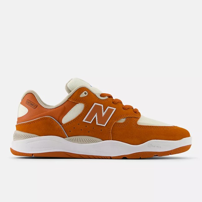 Orange and cream New Balance sneakers