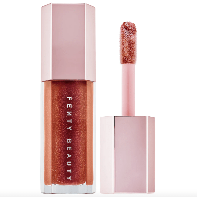 Fenty Beauty Gloss Bomb in Hot Chocolit in a clear tube.