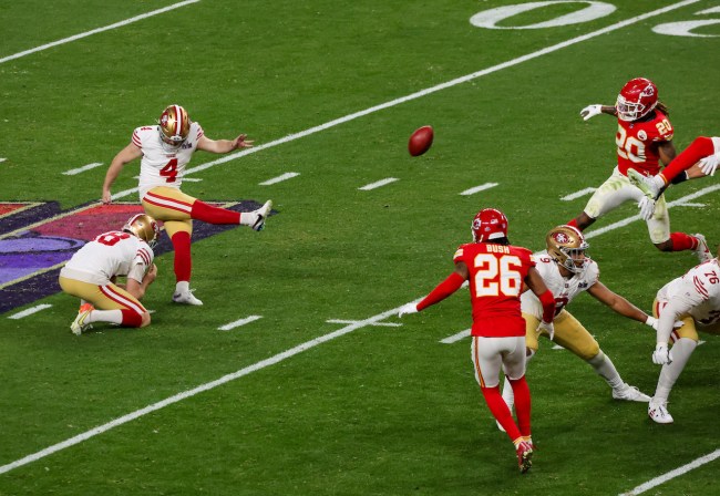 Punter Mitch Wishnowsky #18 of the San Francisco 49ers holds as place kicker Jake Moody #4 kicks a 27-yard field goal against the Kansas City Chiefs in overtime of Super Bowl LVIII at Allegiant Stadium on February 11, 2024 in Las Vegas, Nevada. The Chiefs defeated the 49ers 25-22 in overtime.