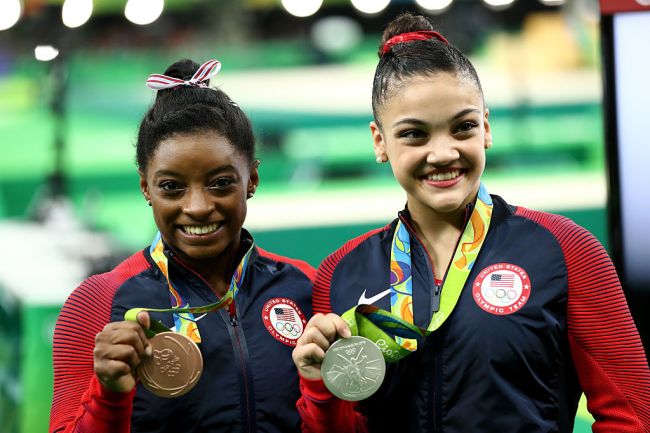 Bronze medalist Simone Biles (L) and silver medalist Lauren Hernandez (R) of the United States pose for photographs after the at the medal ceremony for  the Balance Beam on day 10 of the Rio 2016 Olympic Games at Rio Olympic Arena on August 15, 2016 in Rio de Janeiro, Brazil.