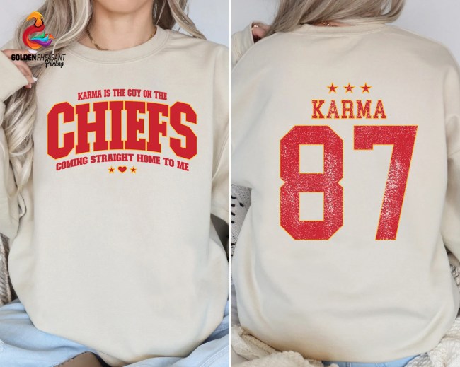 A beige sweatshirt with red text that reads "Karma is the guy on the chiefs coming straight home to me"