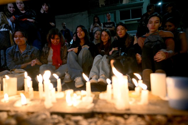 TOPSHOT - Fans of British singer Liam Payne lit candles next to the hotel where he died in Buenos Aires on October 16, 2024. British singer Liam Payne, former member of the group One Direction, died Wednesday aged 31 after falling from the third floor of a hotel in Argentina, police in Buenos Aires said.