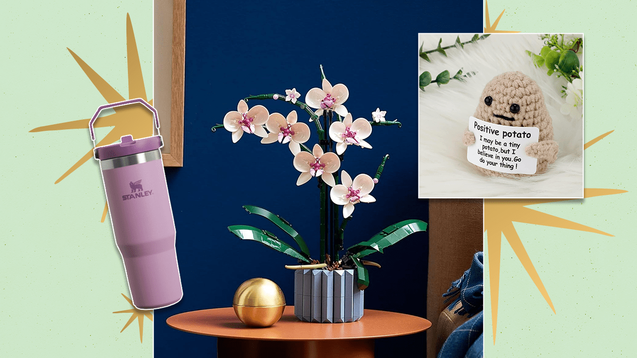 Left to Right: Light purple Stanley Tumbler, LEGO orchid set built and sitting on an orange side table, a knitted potato holding a motivational sign