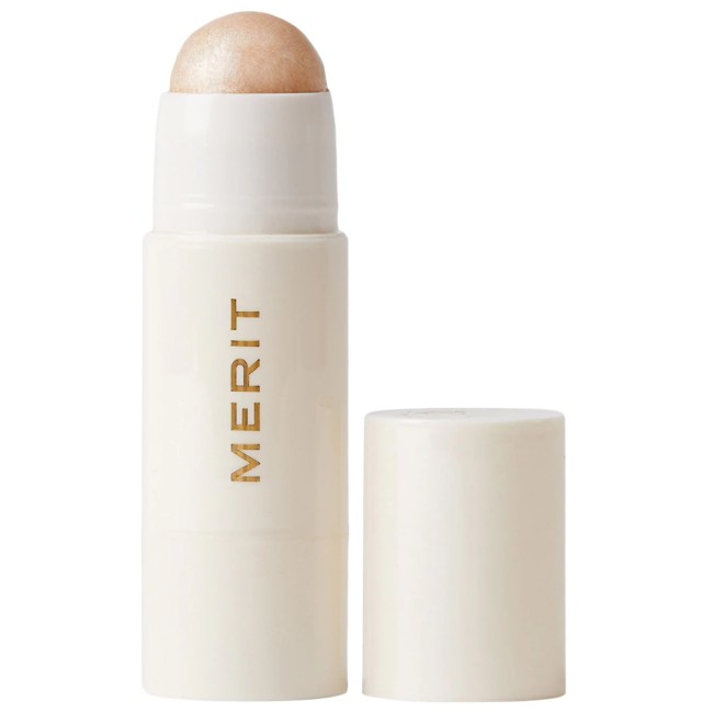 Merit Day Glow Dewy Highlighting Balm in a white tube.