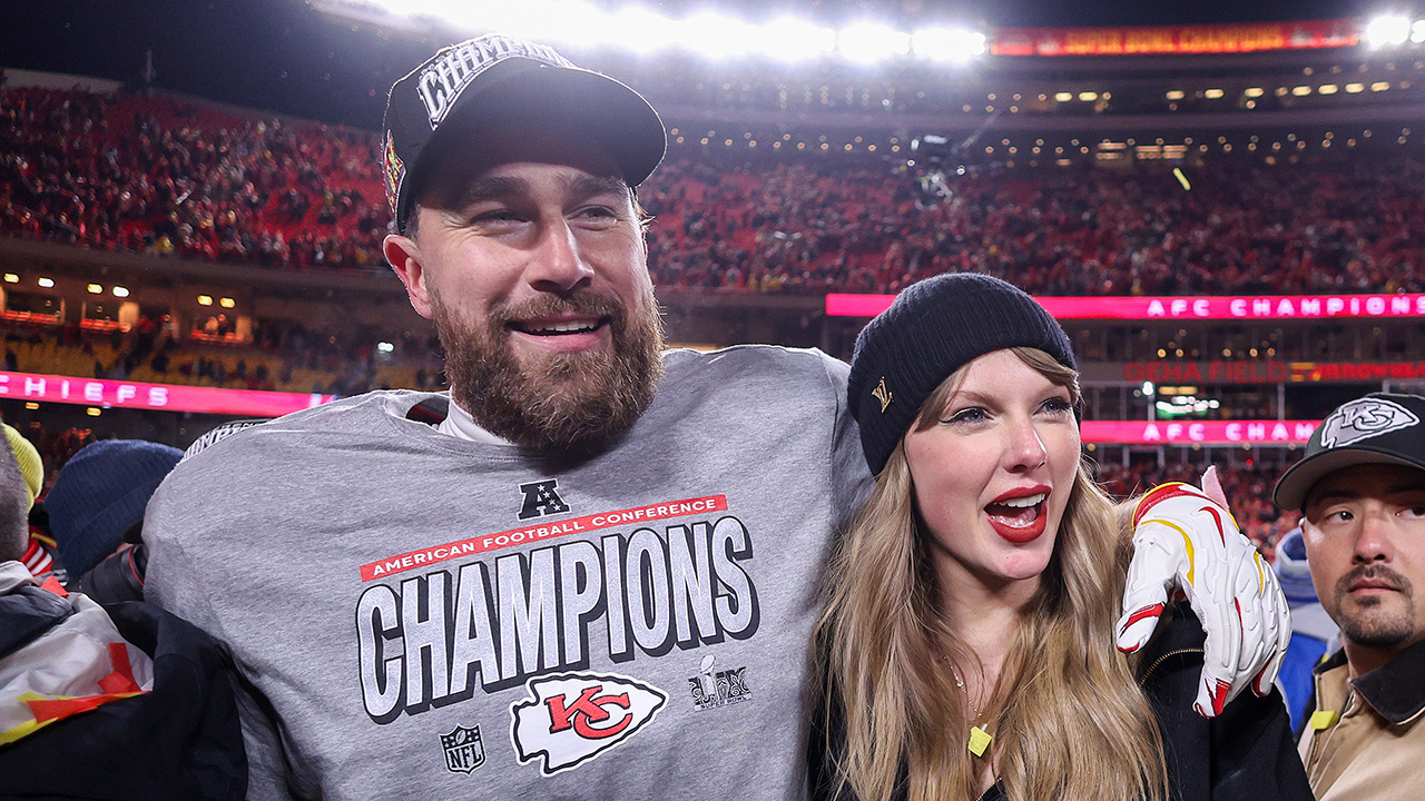 KANSAS CITY, MISSOURI - JANUARY 26: Taylor Swift celebrates with Travis Kelce #87 of the Kansas City Chiefs after defeating the Buffalo Bills 32-29 in the AFC Championship Game at GEHA Field at Arrowhead Stadium on January 26, 2025 in Kansas City, Missouri.