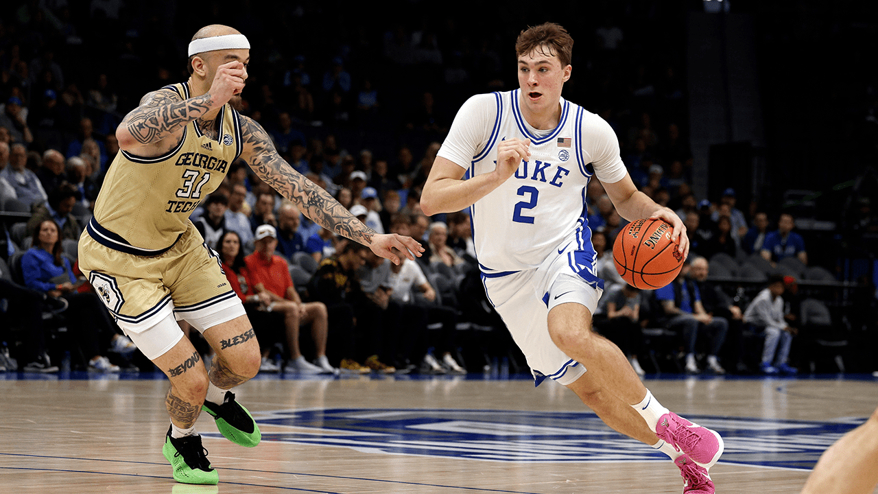 CHARLOTTE, NORTH CAROLINA - MARCH 13: Cooper Flagg #2 of the Duke Blue Devils drives with the ball against Duncan Powell #31 of the Georgia Tech Yellow Jackets during the first half in a quarterfinal game of the ACC men's basketball tournament at Spectrum Center on March 13, 2025 in Charlotte, North Carolina.