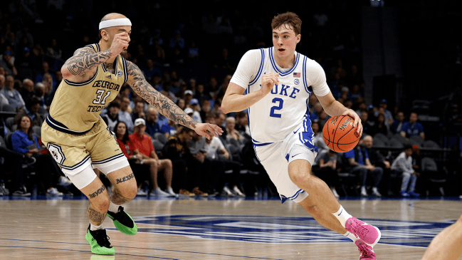 CHARLOTTE, NORTH CAROLINA - MARCH 13: Cooper Flagg #2 of the Duke Blue Devils drives with the ball against Duncan Powell #31 of the Georgia Tech Yellow Jackets during the first half in a quarterfinal game of the ACC men's basketball tournament at Spectrum Center on March 13, 2025 in Charlotte, North Carolina.