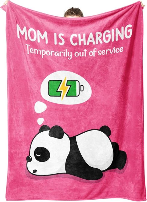A pink throw blanket with the text 'Mom Is Charging Temporarily out of service'