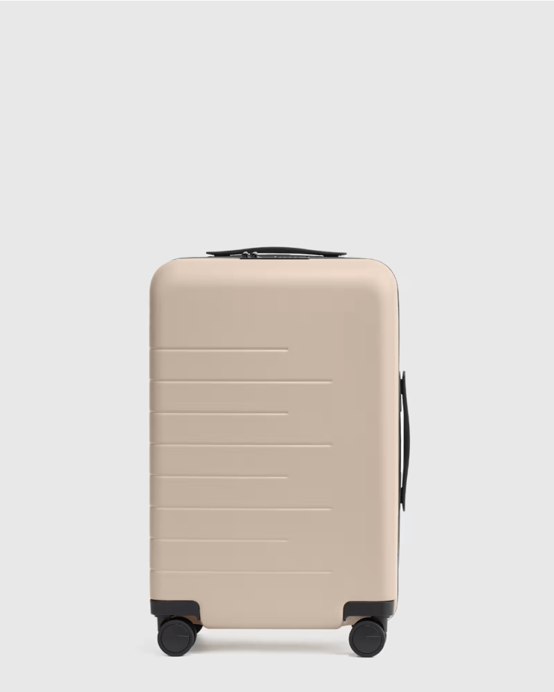 A product shot of the Quince Small Carry-On Suitcase in Tan