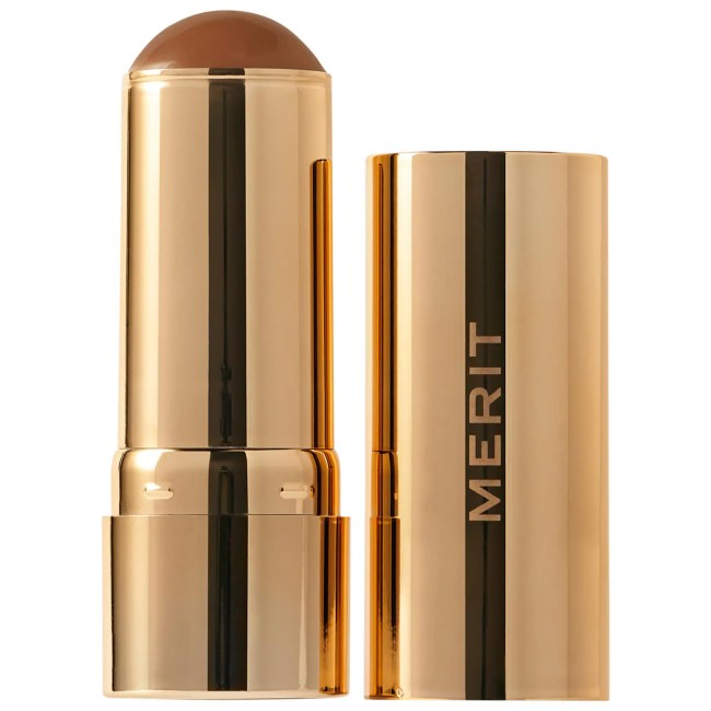 Merit Bronze Balm Sheer Sculpting Bronzer in a gold tube.