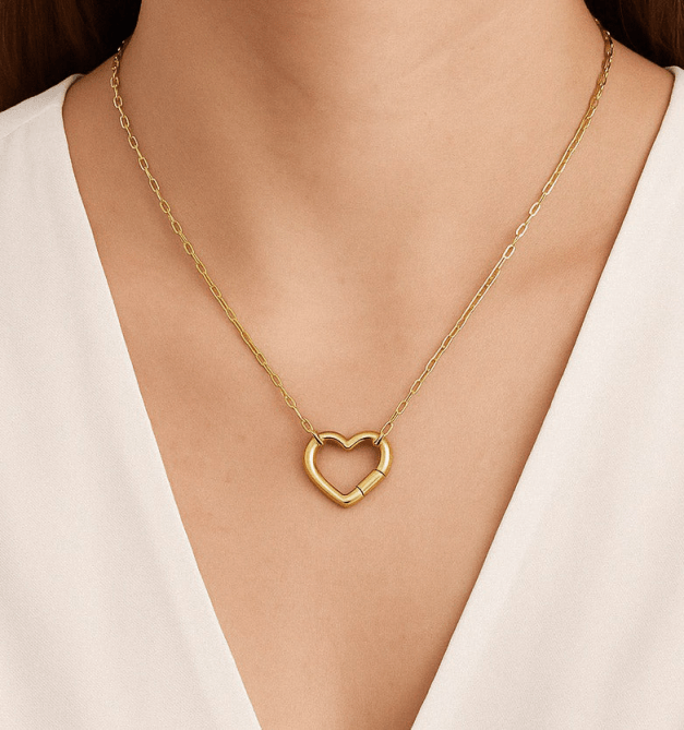 A model wearing the Rellery Personalized Heart Charm Chain - Paperclip Chain in gold