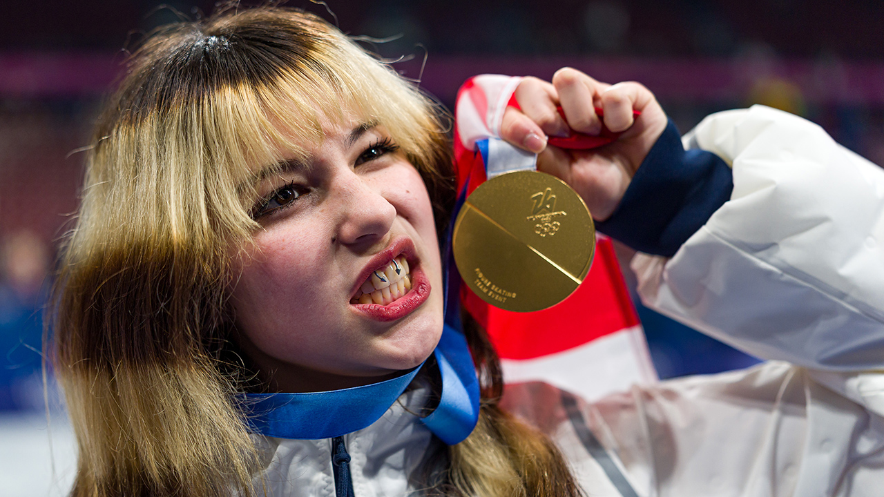 MILAN, ITALY - FEBRUARY 08: Gold medalist Alyssa Liu of Team United States poses with the medal after the medal ceremony for the Team Event on day two of the Milano Cortina 2026 Winter Olympic games at Milano Ice Skating Arena on February 08, 2026 in Milan, Italy.