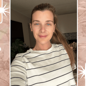 A selfie of a woman with two cleanser bottles